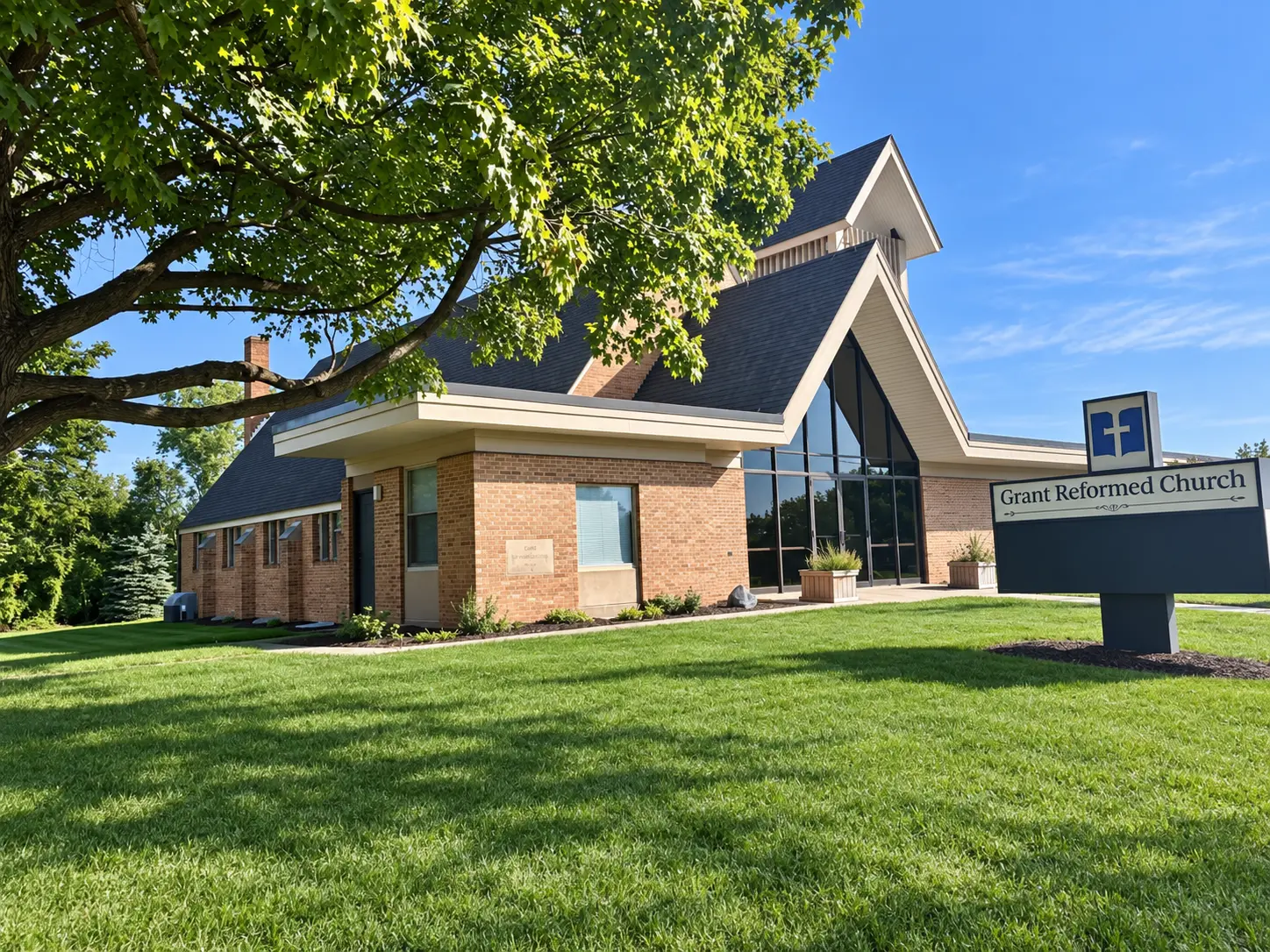 Grant Reformed Church beneath a leafy tree